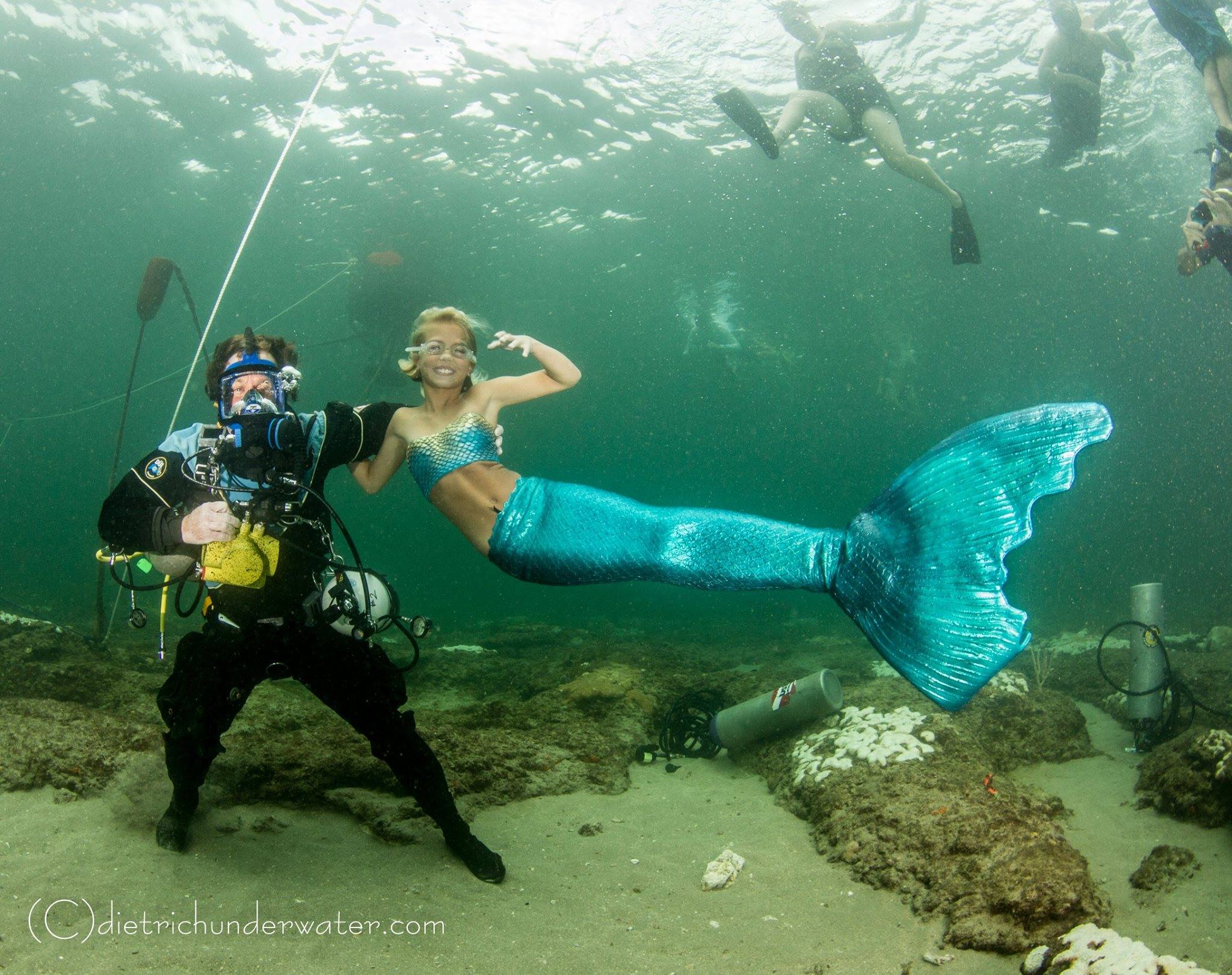 Allen underwater in SCUBA gear with Mermaid Paige